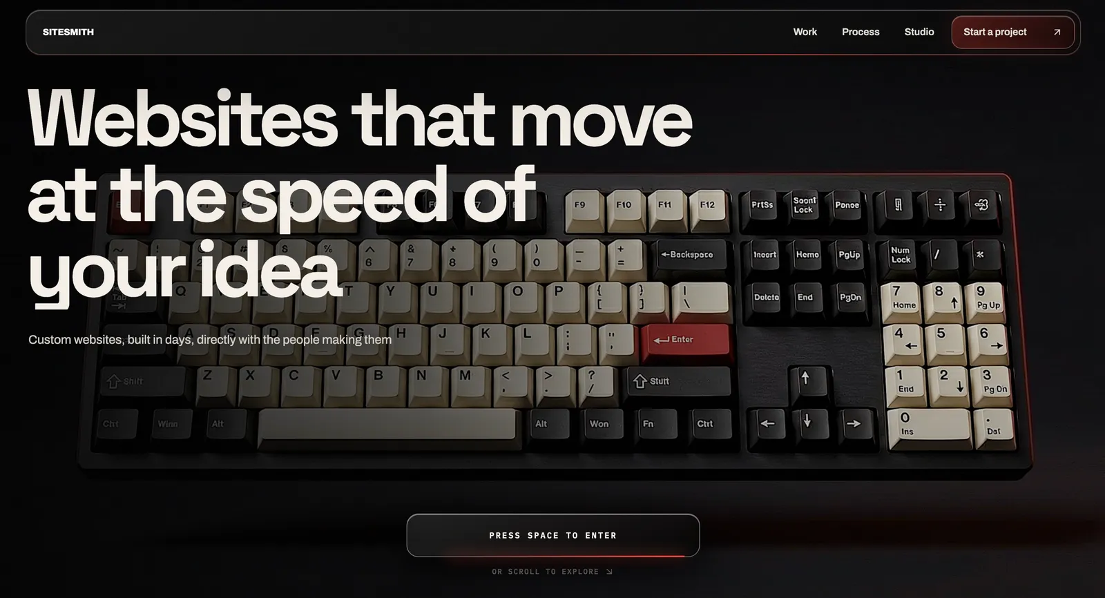 SiteSmith homepage: ’Websites that move at the speed of your idea’ over a mechanical keyboard